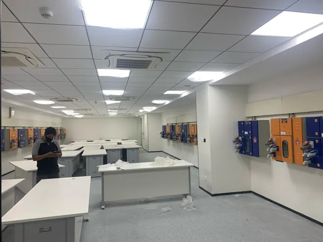 Technical workspace with ceiling cassette air conditioning and lighting