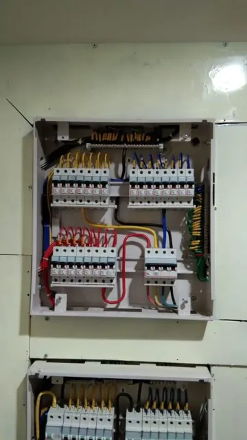 Wall-mounted circuit breaker panels and wiring