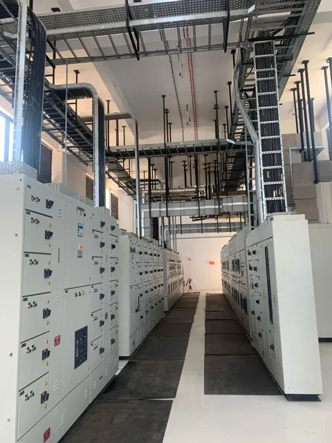 Switchgear panels with vertical and overhead cable trays
