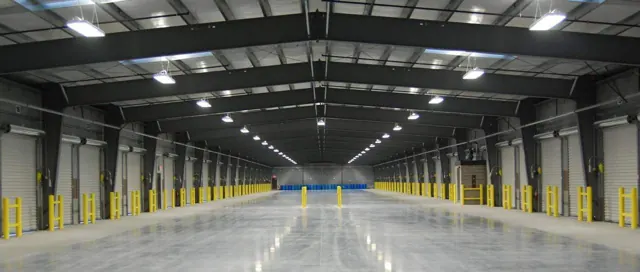 Warehouse interior with overhead industrial lighting